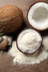 Coconut flour and fresh fruits on wooden table, flat lay