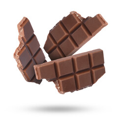 Pieces of sweet chocolate falling on white background