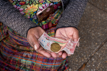 local money in woman's hands in Guatemala