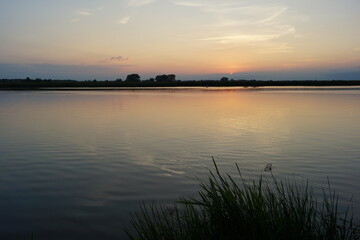 Obraz premium sunset over the river
