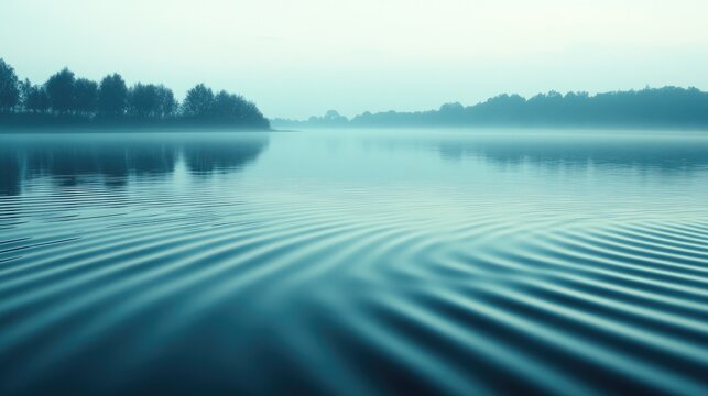 A gentle breeze creating ripples on a calm lake, providing a peaceful and tranquil scene with space for text.