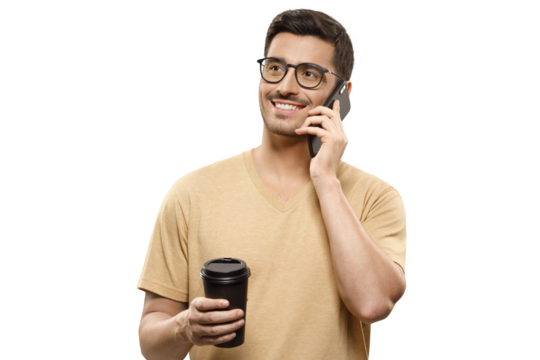 Young man in beige t-shirt and glasses, talking on the phone with positive smile, holding takeaway coffee cup