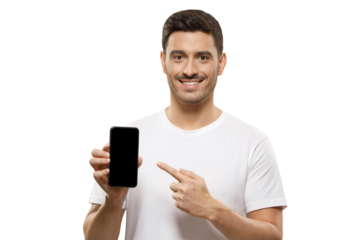 Young handsome man in white t-shirt holding phone, pointing to blank screen with finger, recommending mobile app