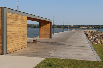 New architecture and riverside. Dock and urban planning. Construction in wood on a dock and in a coastline. Development at the riverside of Quebec city and St-Laurent river. Summer landscape.