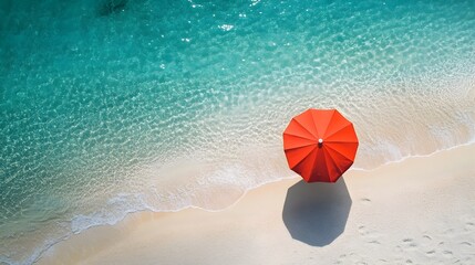 Obraz premium Aerial View of Solitary Red Umbrella on Pristine Summer Beach with Clear Turquoise Waters