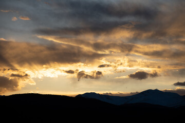 Sun setting Behind the Colorado Rocky Mountains
