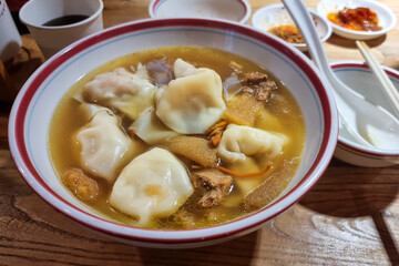 Popular authentic Sichuan dumpling soup or jiaozi in restaurant in Chengdu, China