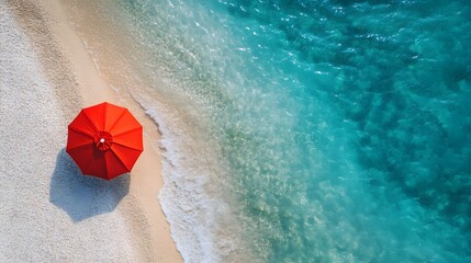 Fototapeta premium Aerial View of Vibrant Red Umbrella on Idyllic Summer Beach