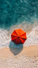 Fototapeta premium Overhead Aerial View of Vibrant Red Umbrella on Pristine Summer Beach