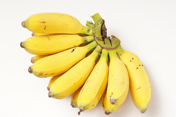 One large bunch of ripe Raja bananas (Musa acuminata), with a vibrant yellow color, photographed against a white background.