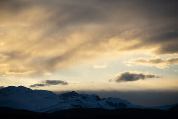 Sun setting Behind the Colorado Rocky Mountains