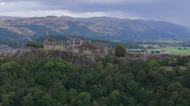 Aerial view of Stirling Castle in Stirling, city in central Scotland. Mountains in background on cloudy day