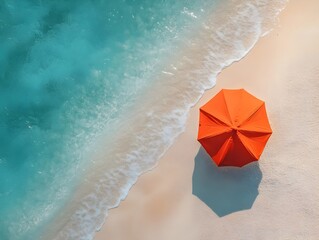 Naklejka premium Aerial View of Isolated Beach with Vibrant Orange Umbrella