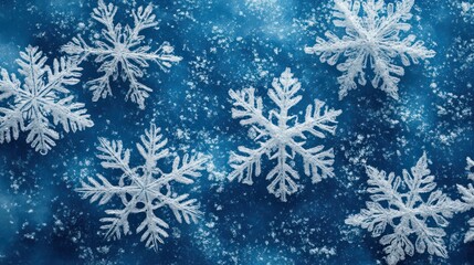 Close-up of intricate snowflake patterns on a blue background