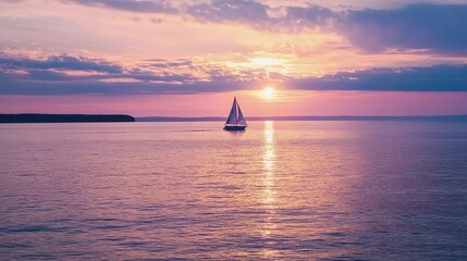 Beautiful sunset over Lake Superior with a sail boat which is very impressive