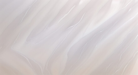 Fototapeta premium A texture of smooth, polished marble in soft pastel tones, showcasing the subtle veining and luxurious finish, with copy space on a plain white background for a minimalist design.