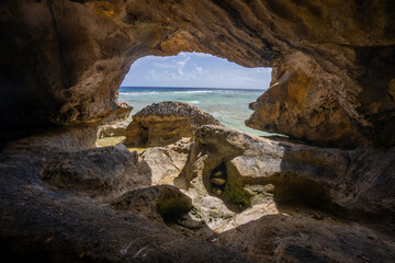 A cave looking out to sea in the Avaiki Cave location in Niue South Pacific
