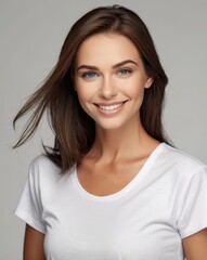 Fototapeta premium beautiful woman blue eyes, dark brown thick smooth straight shiny and silky hair, smiling, white t-shirt, white background professional photography in studio