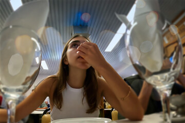 A young woman in a restaurant