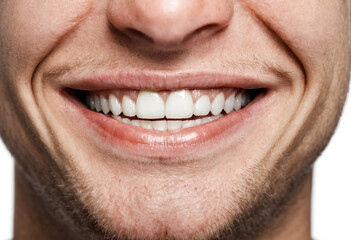 Fototapeta premium Laughter of a young adult man, age 25-35, close-up of white teeth and lips, joyful, happy, and content.