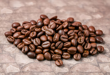 Roasted coffee beans on a textured background