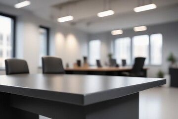 A black blurred office interior featuring a desk with a laptop and computer, complete with a chair, monitor, keyboard, and other workspace essentials