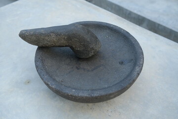 Closeup of a stone mortar and pestle.