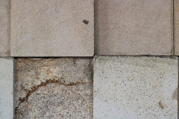 Close-up of a stone wall with different textures.