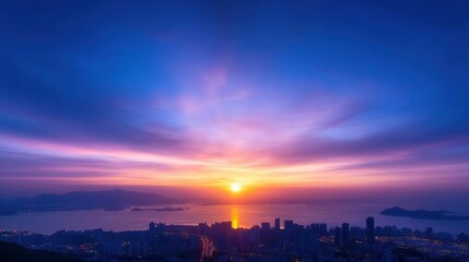 Breathtaking sunset over a city skyline, showcasing vibrant colors in the sky and serene reflections on the water.