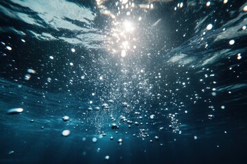 A captivating underwater scene showing bubbles rising to the surface with light filtering