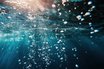 A captivating underwater scene showing bubbles rising to the surface with light filtering