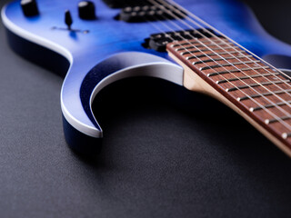 Fretboard of modern electric guitar. Close up.