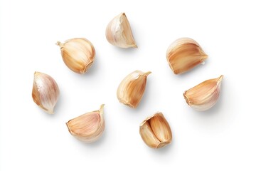 Cloves of garlic on white surface