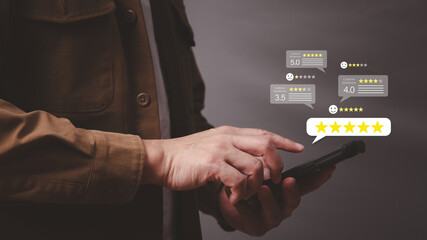 Online customer service satisfaction Survey and quality of service concept, man using smartphone to...