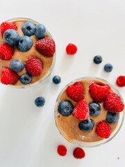 Berry Dessert in Glass with Banana Cacao Cream Photo