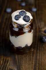 delicious blueberry-flavored yogurt in a glass jar