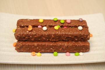 Chocolate wafers on a white plate, close-up
