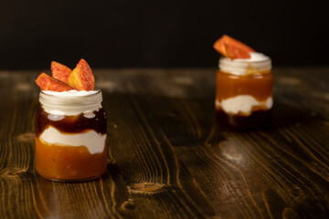 natural yogurt in a glass jar with fruits