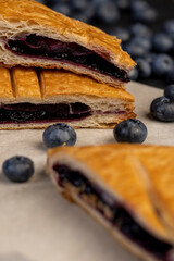 close-up of a blueberry stuffed bun with blueberries