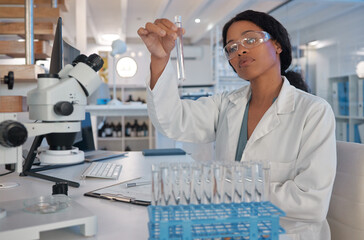 Scientist, test tube and science in lab for research, biotechnology or monkeypox vaccine...