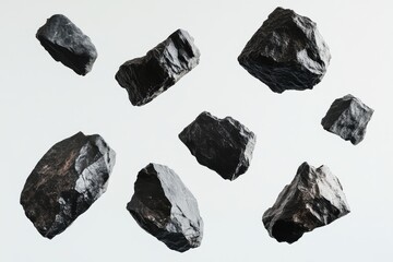A group of dark, rugged rocks floating in mid-air against a white background