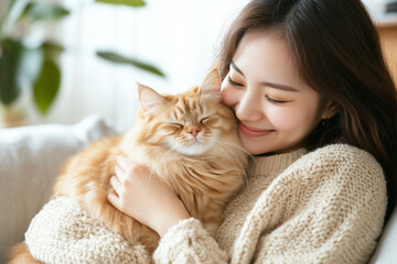 Young Asian woman is hugging a persian cat with indoor scene, human-animal relationships.	
