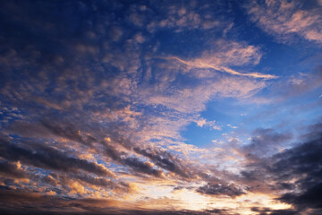 Cloudscape, Colored Clouds at Sunset near the Ocean in a Blue Sky