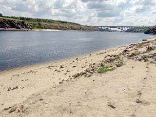 The landscape of the rocky Dnieper bank, which has significantly increased in size after a dry,...