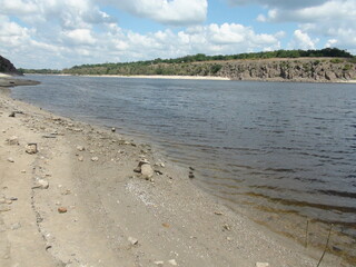 Barely noticeable Dnieper waves that gently touch the sandy shore and dazzle the viewer with...
