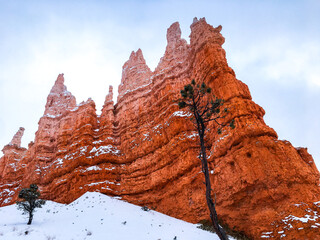 Snow scene colorful cliffs with red rock and stone in Bryce Canyon National Park