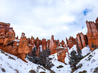 Snow scene colorful cliffs with red rock and stone in Bryce Canyon National Park