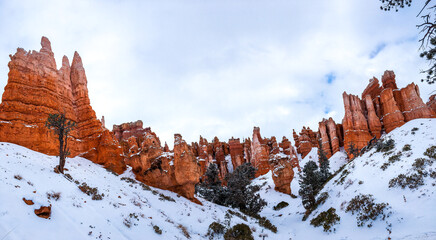 Snow scene colorful cliffs with red rock and stone in Bryce Canyon National Park