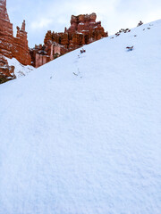 Snow scene colorful cliffs with red rock and stone in Bryce Canyon National Park