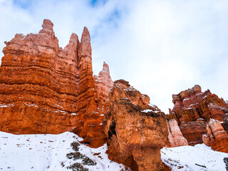 Snow scene colorful cliffs with red rock and stone in Bryce Canyon National Park